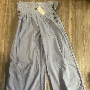 Blue and white pin stripe wide leg pants with button accent on side